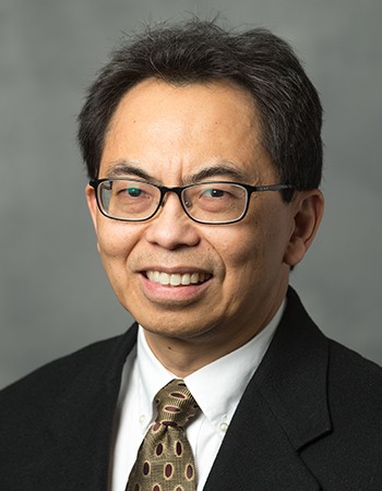 Portrait of Dr. Lim, smiling